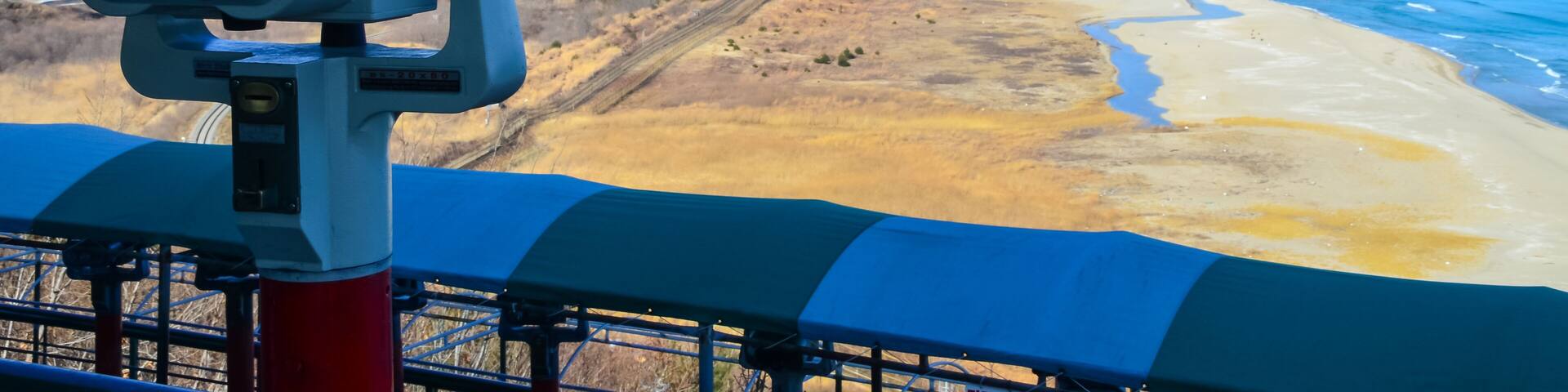 Binocular in the Goseong Unification Observatory with a background of beach and mountains.