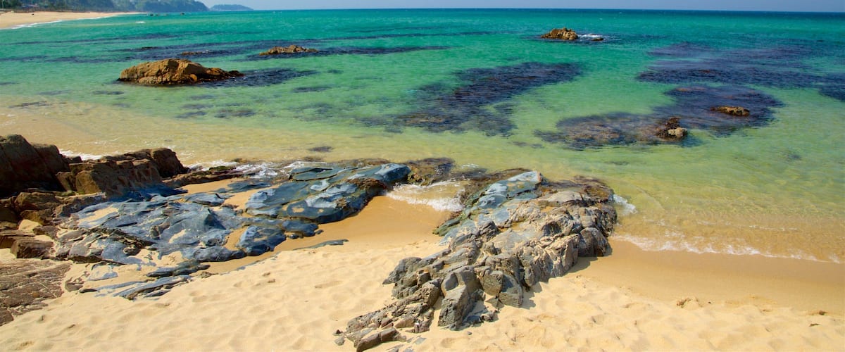 Jeongdongjin Beach showing general coastal views, a sandy beach and rocky coastline