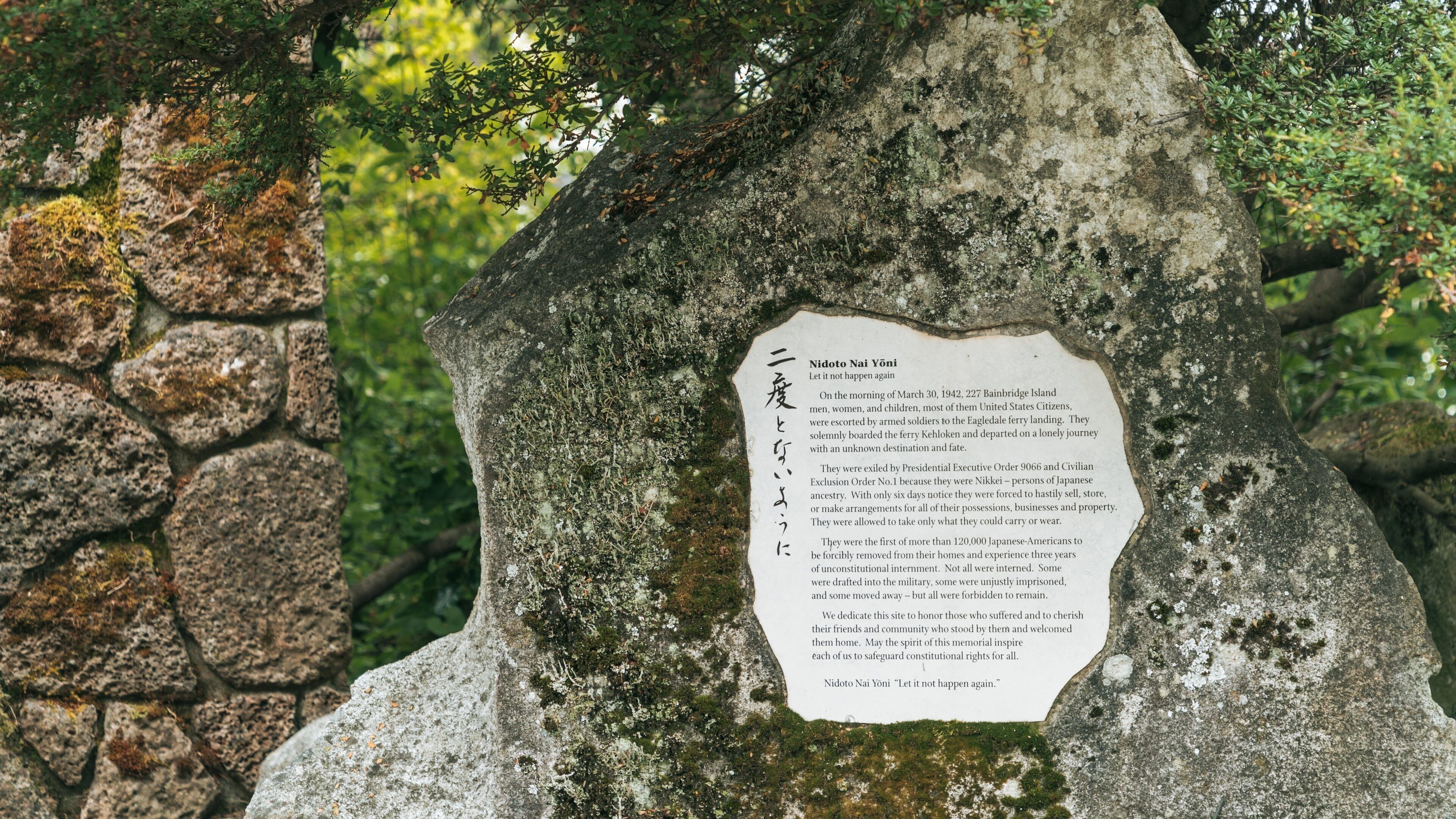 A stone monument with a plaque containing a historical inscription.