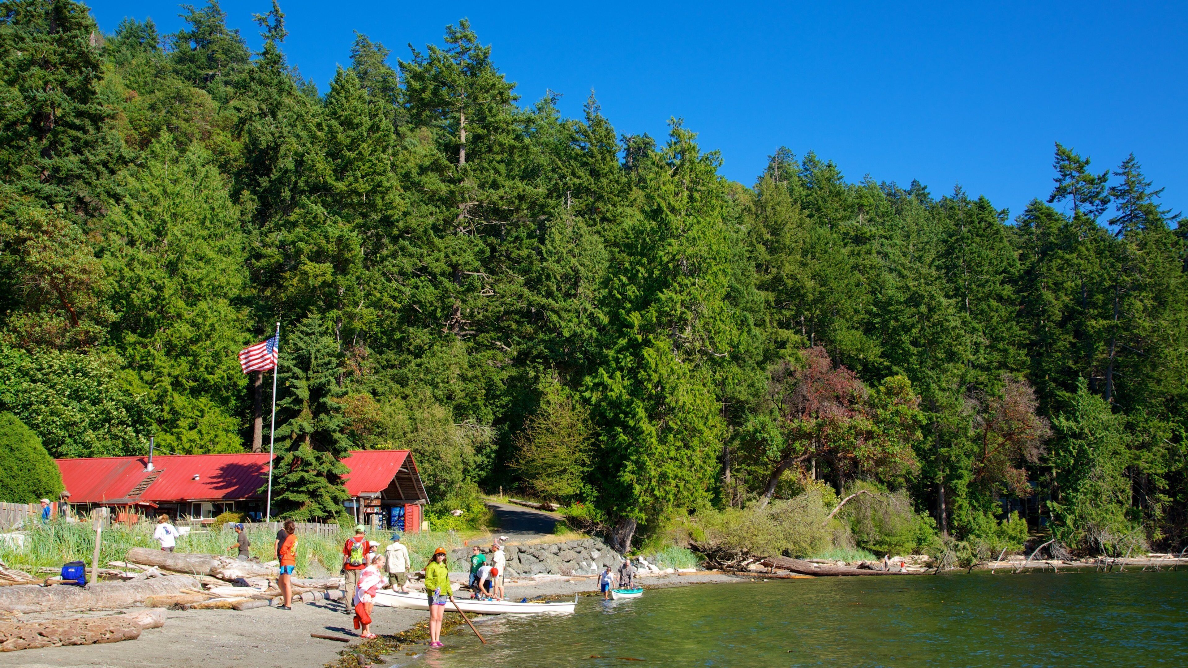 San Juan County Park showing a lake or waterhole as well as a small group of people