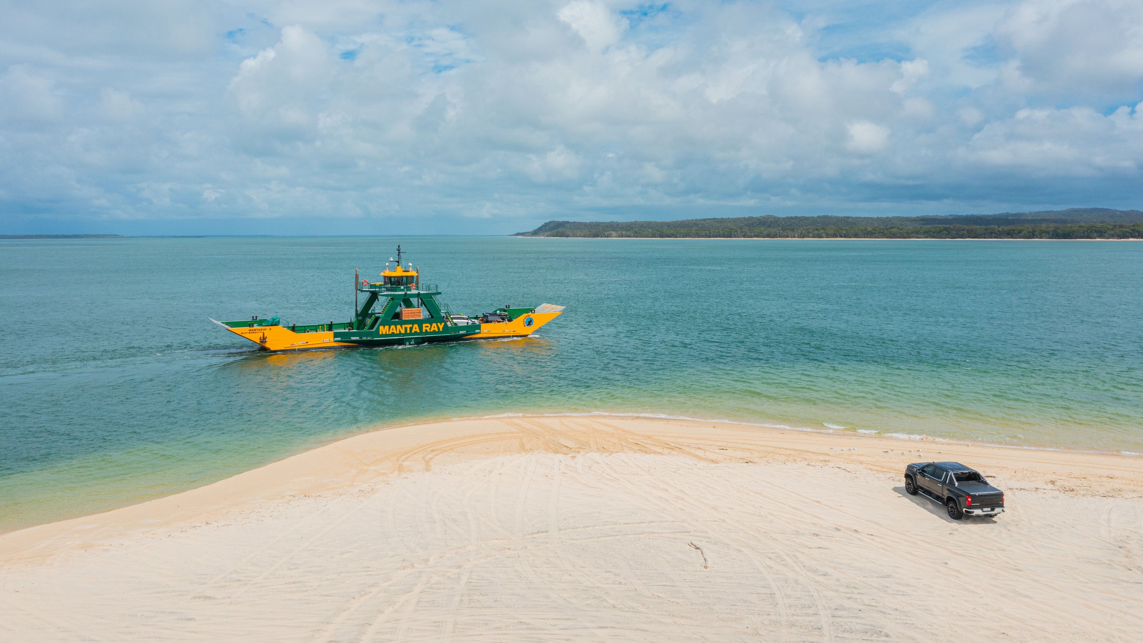 Inskip Point showing general coastal views, a beach and off road driving