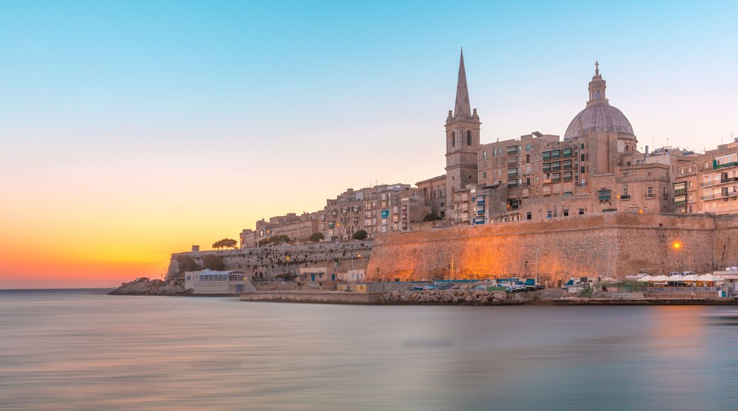 Valletta Skyline with churche of Our Lady of Mount Carmel and St. Paul's Anglican Pro-Cathedral, at dawn, Valletta, Capital city of Malta