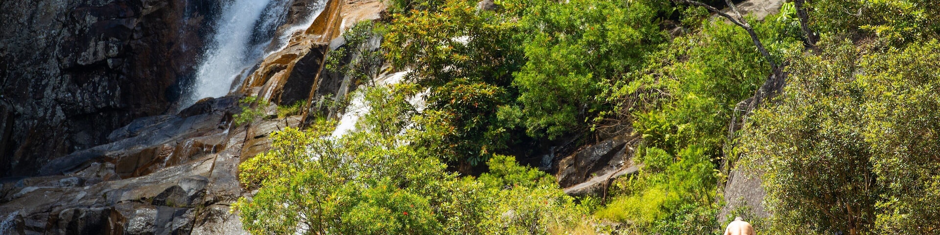 Behana Gorge featuring a waterfall as well as an individual male