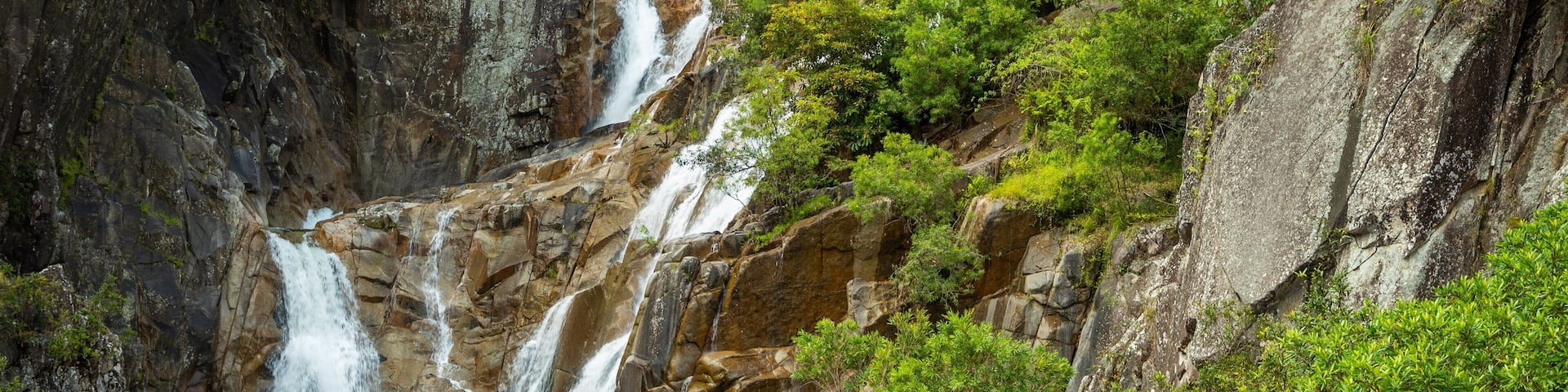 Behana Gorge showing a river or creek and a waterfall as well as a couple