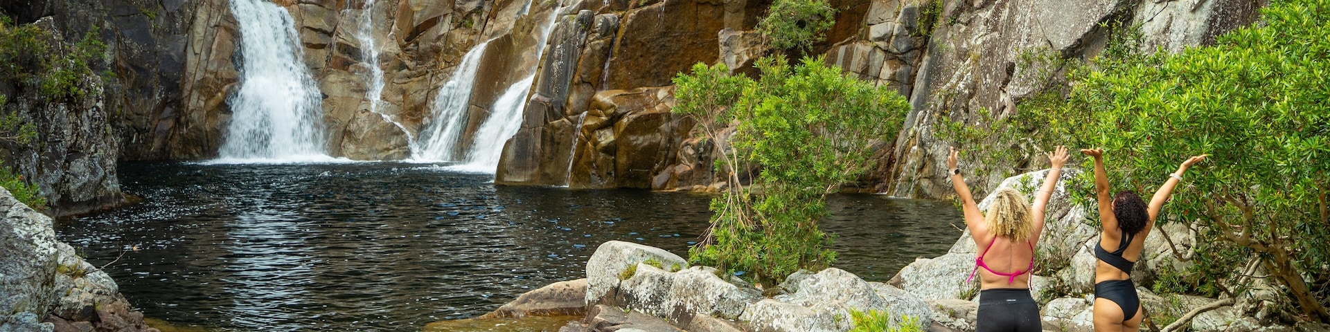 Behana Gorge showing a river or creek and a waterfall as well as a couple