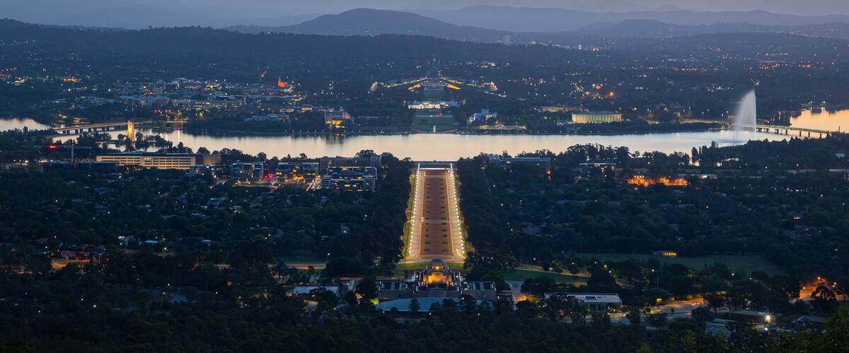 Mount Ainslie showing landscape views, a sunset and a city