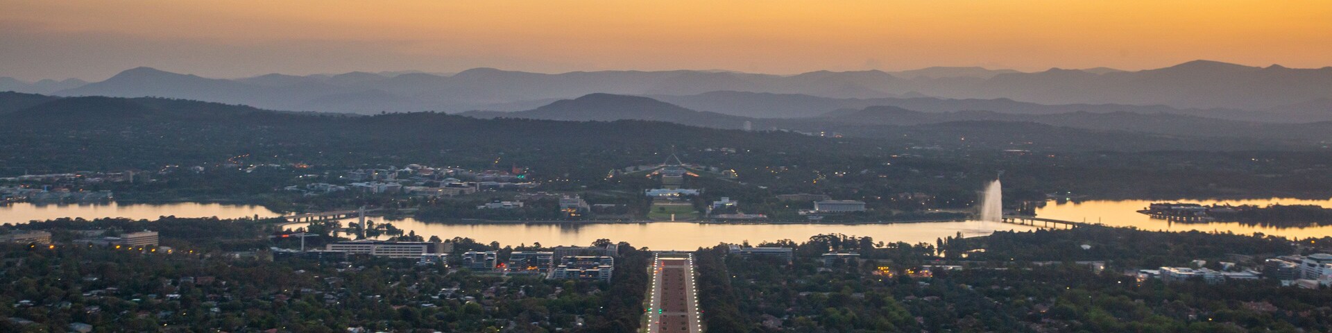 Mount Ainslie featuring a city, a sunset and landscape views