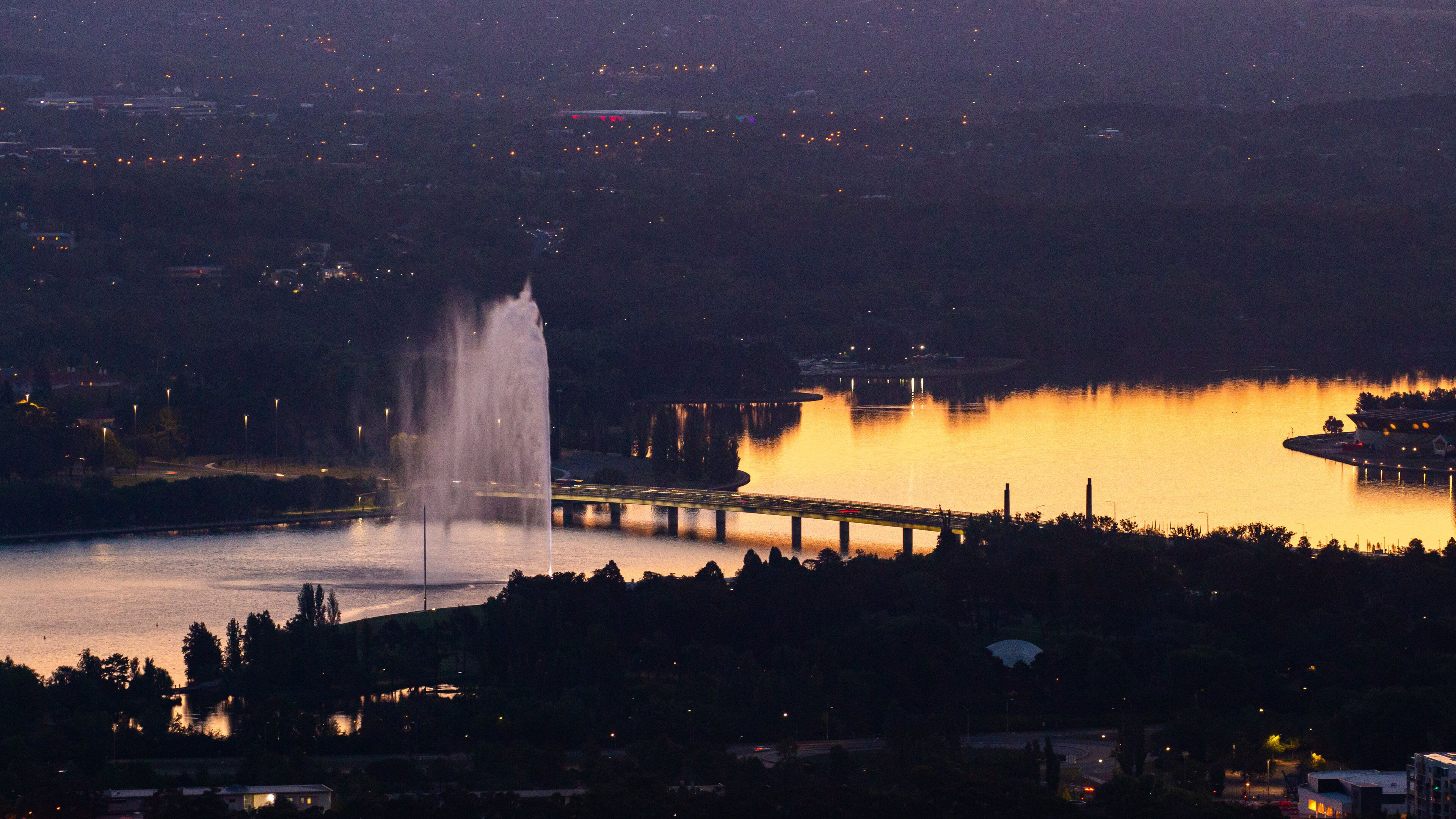 Mount Ainslie which includes landscape views, a sunset and a bridge