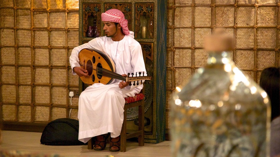 Arabian Nights Village featuring interior views and music as well as an individual male
