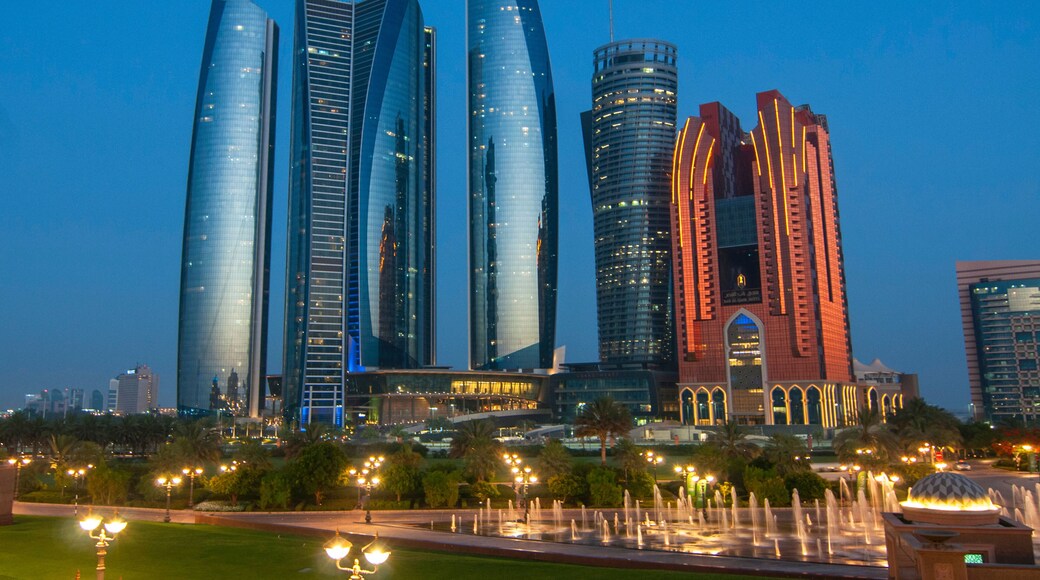 Skyscrapers of Abu Dhabi at night with Etihad Towers buildings. Abu Dhabi is the capital and the second most populous city of the United Arab Emirates.