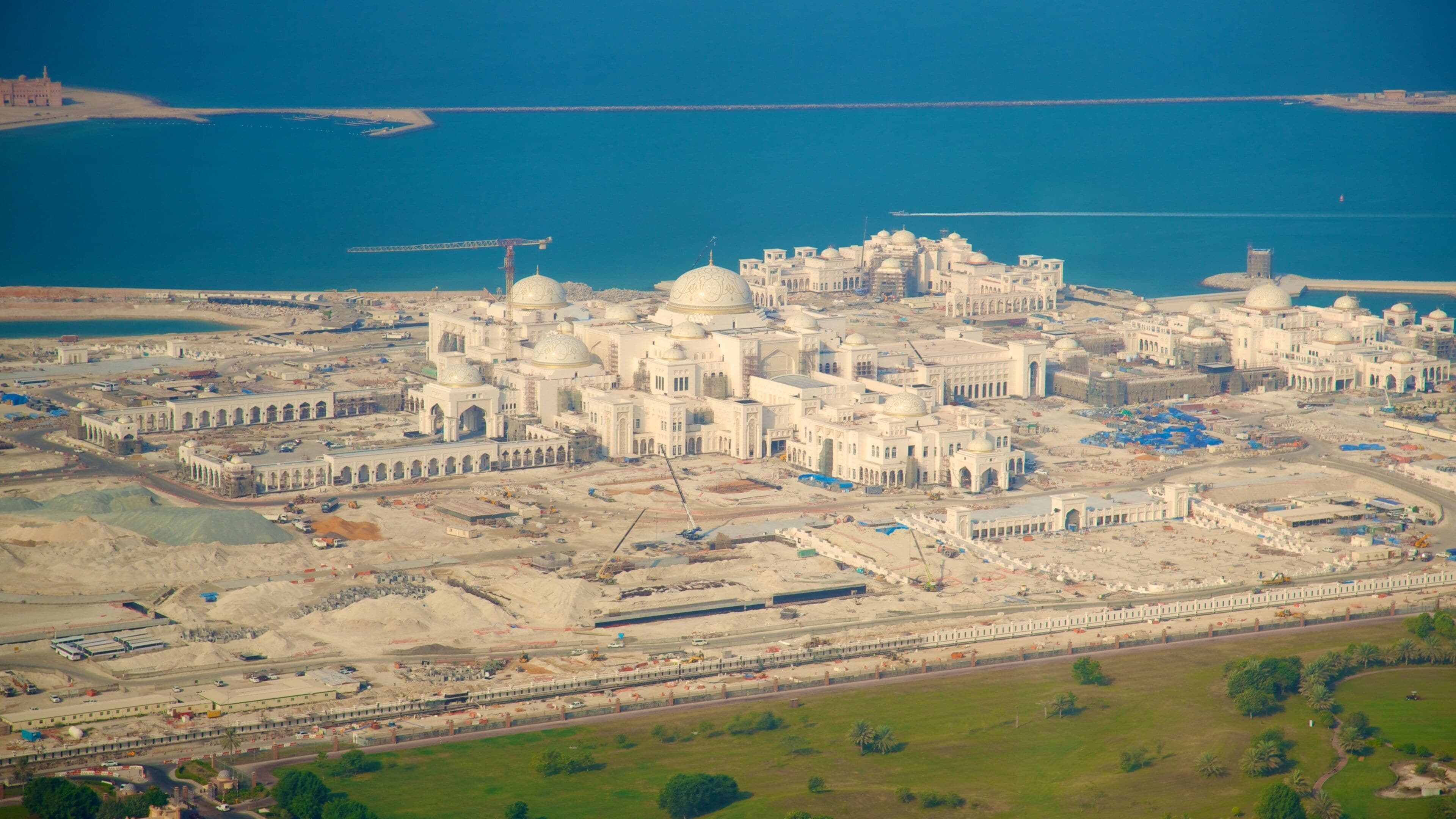 Etihad Towers showing a city and a coastal town