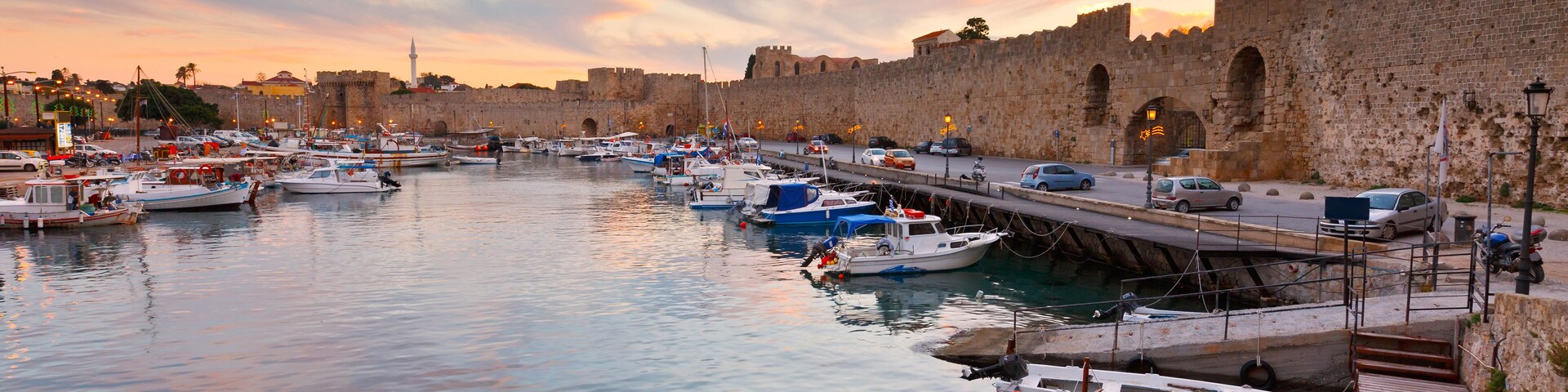 Old harbor and city walls of the medieval town of Rhodes.