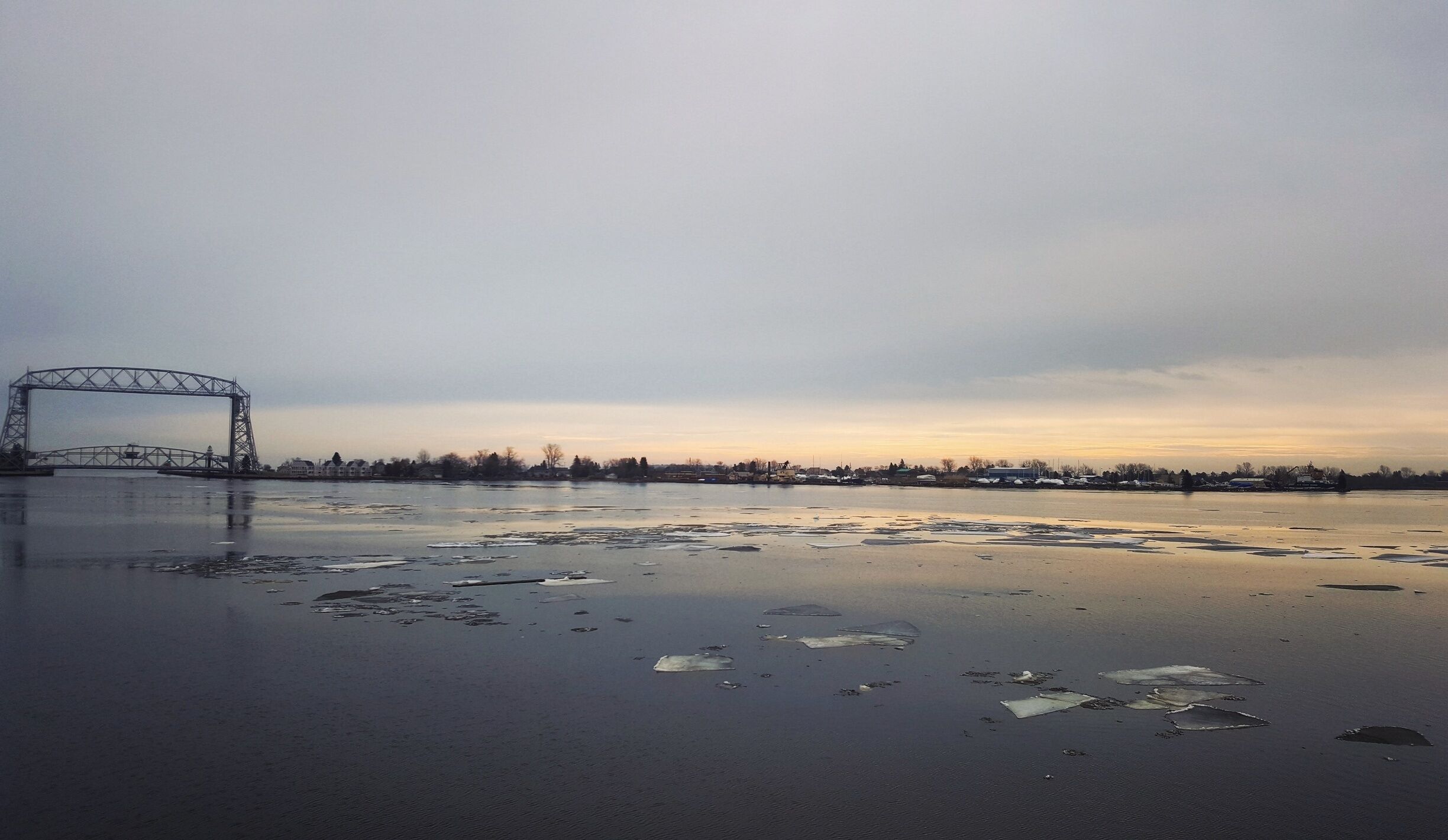 Home. Raised on the shore of the greatest of the great lakes. Forever blown away by the beauty of Superior. The calm waters slowly rocked the ice. Visible just off the boardwalk in canal park. 
