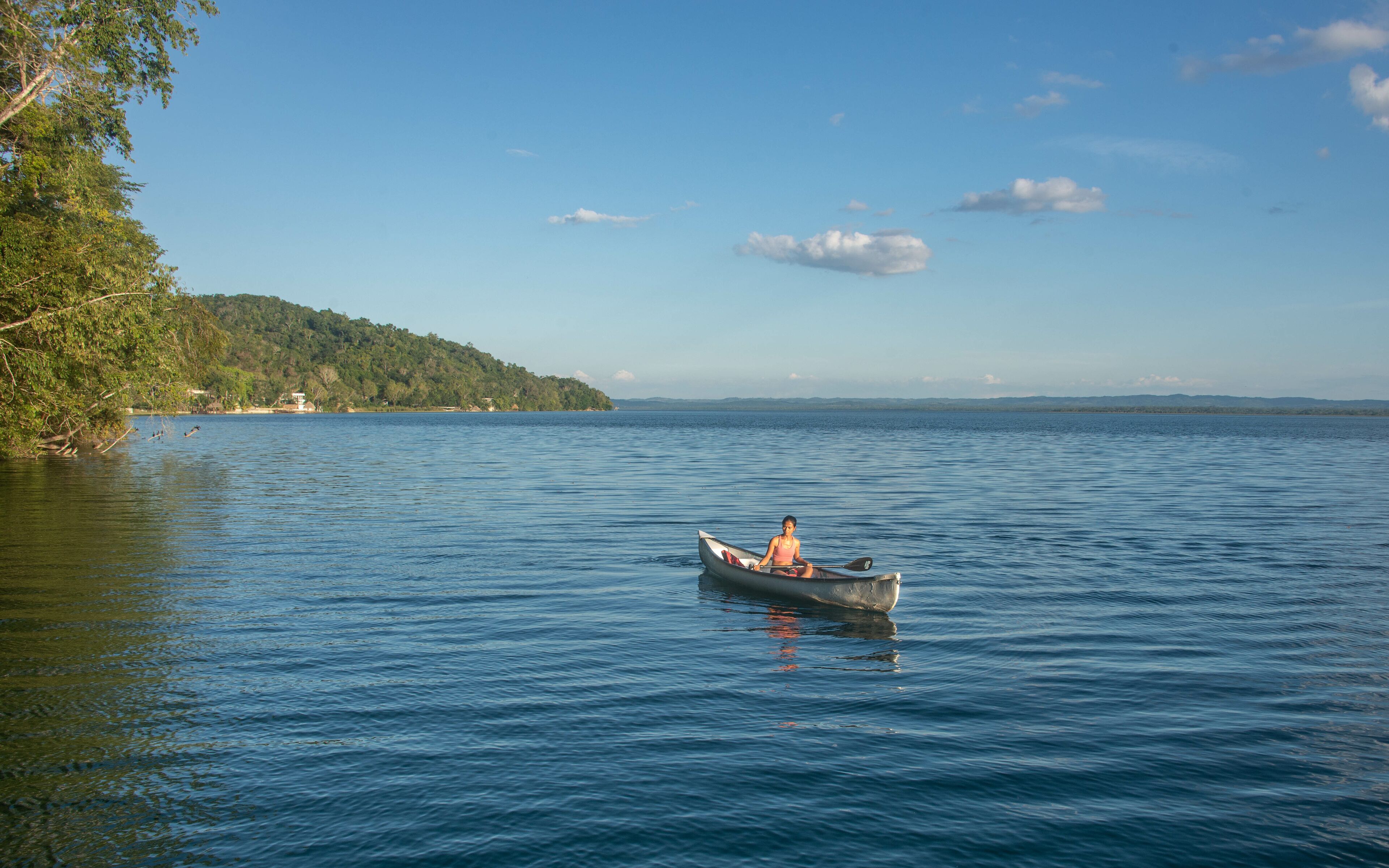 Canoeing on beautiful Lake Peten Itza, El Remate, Petén, Guatemala