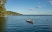 Canoeing on beautiful Lake Peten Itza, El Remate, Petén, Guatemala