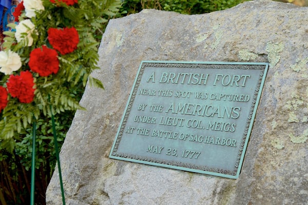 Sag Harbor Old Burying Ground which includes signage and flowers