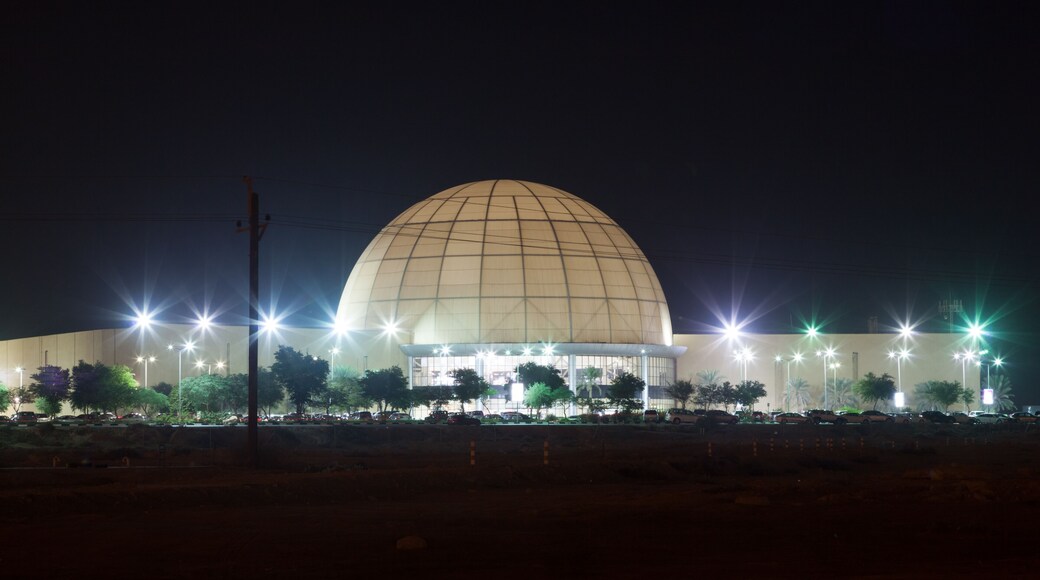Dubai Outlet Mall illuminated at night. Dubai, UAE