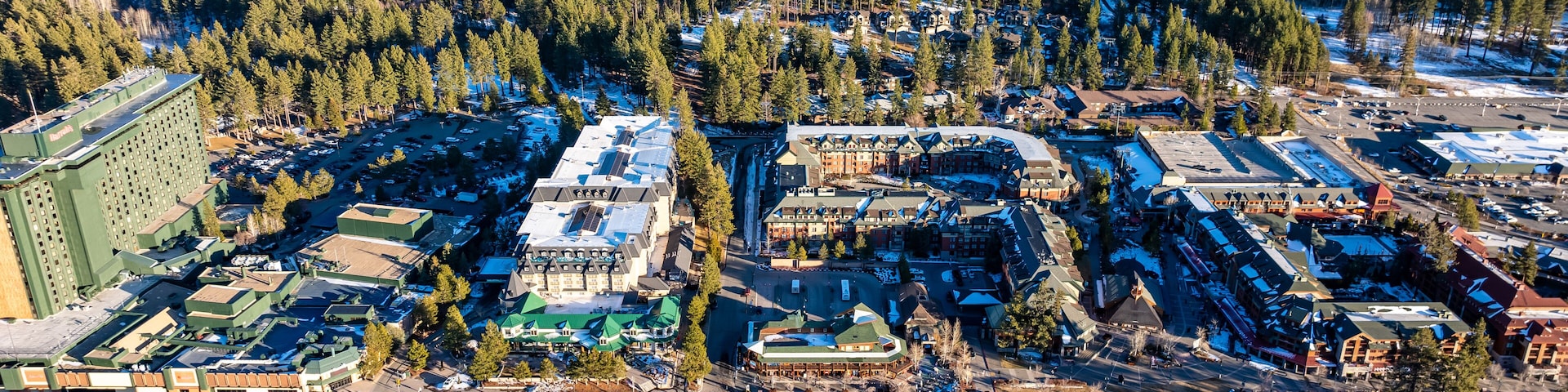 Stateline, NV - January 29, 2025: Daytime winter aerial image over Stateline, NV - South Lake Tahoe, CA at Lake Tahoe, how has weather impacted tourism business of hotels, resorts, and casinos.
