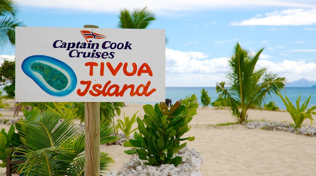 Fiji which includes signage, a sandy beach and tropical scenes