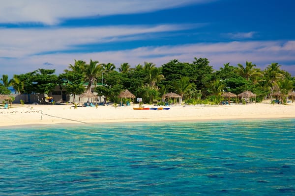 Tivua Island featuring a coastal town, tropical scenes and island views