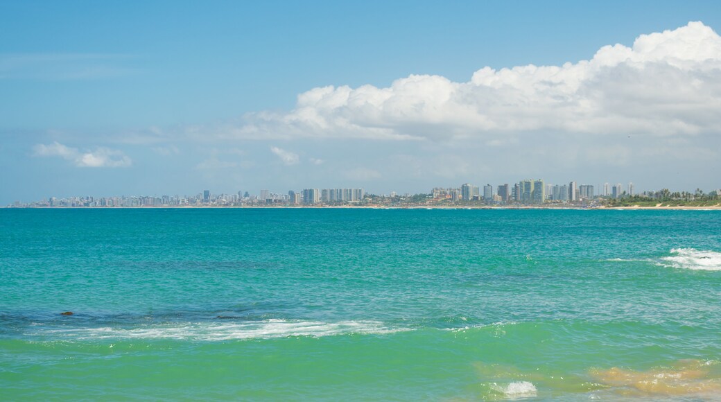 A view of the beach in Itapua, Salvador's cityscape in the background - Bahia, Brazil