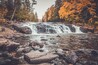 Buttermilk Falls surrounded by brilliant fall foliage in Long Lake NY, ADK Mountains