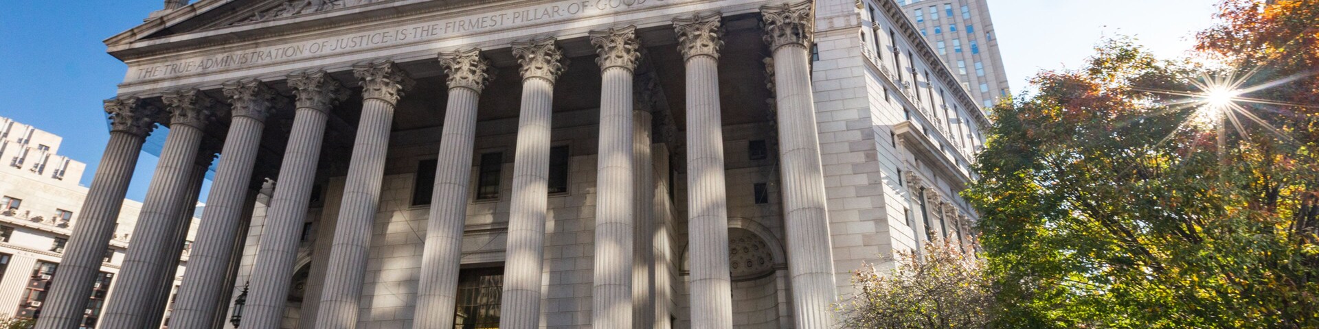 New York Supreme Criminal Court which includes a sunset, heritage architecture and an administrative buidling