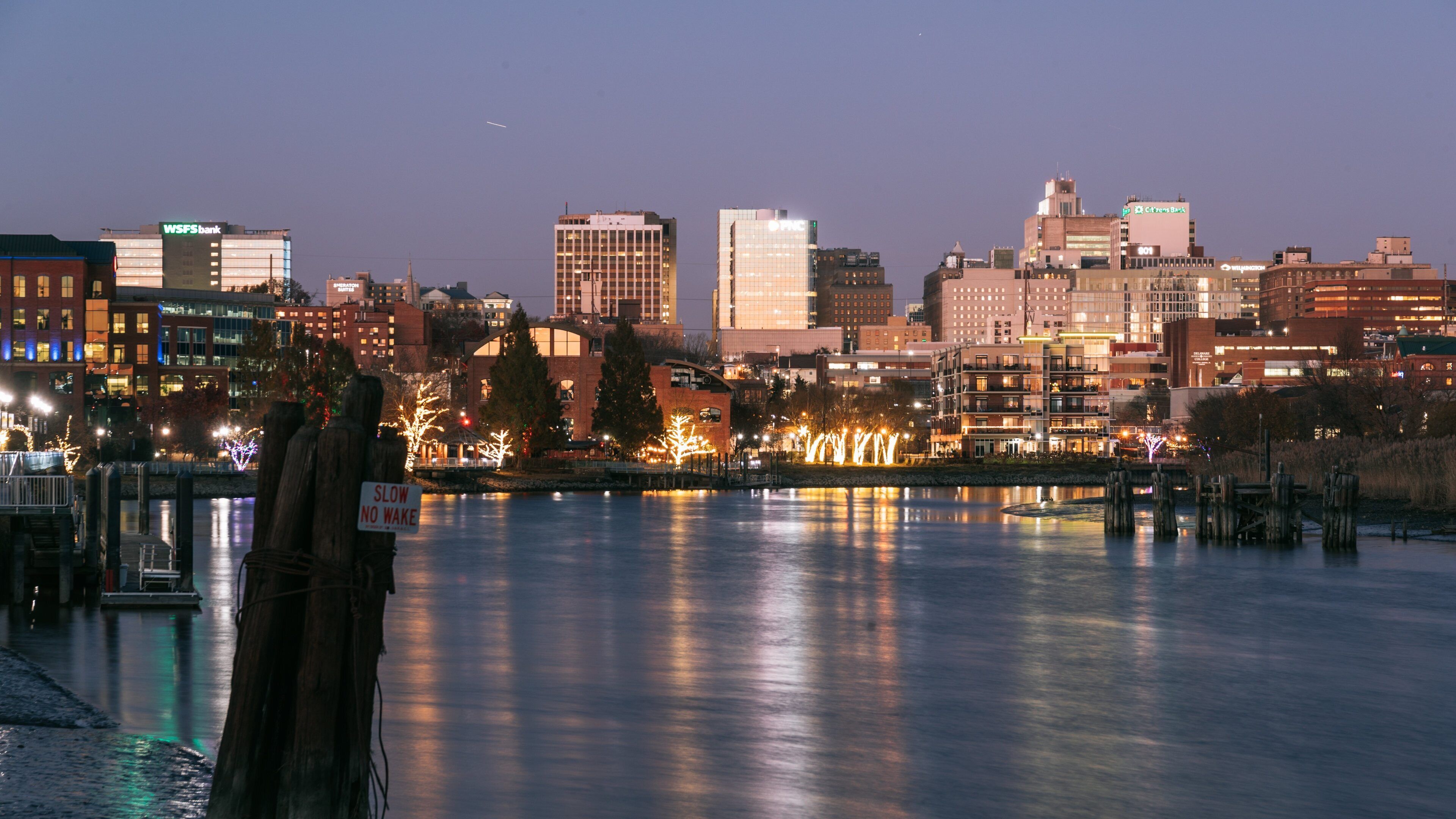Wilmington Riverwalk showing night scenes and a river or creek