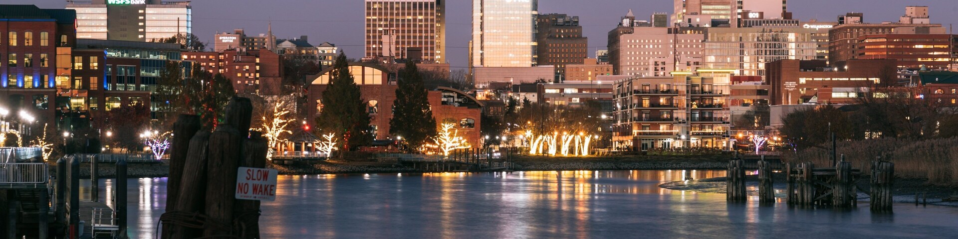 Wilmington Riverwalk showing night scenes and a river or creek