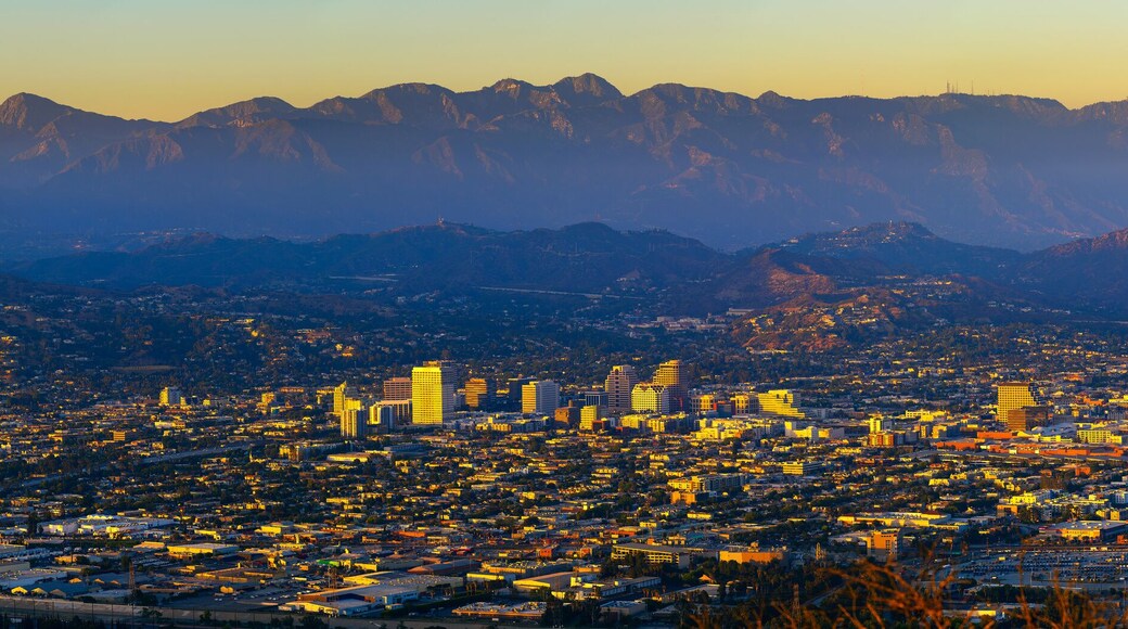 Sunset panorama of downtown Glendale and San Gabriel Mountains in the background viewed from Griffith Park near Los Angeles, California.