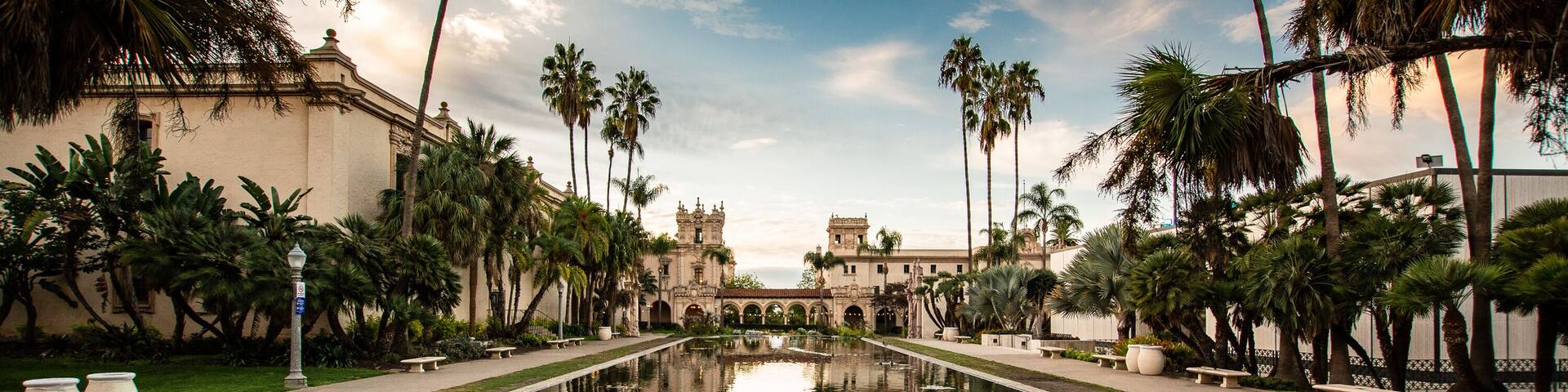 Casa de Balboa, palm trees, and sky reflected in the lily pond at balboa park, san diego, california