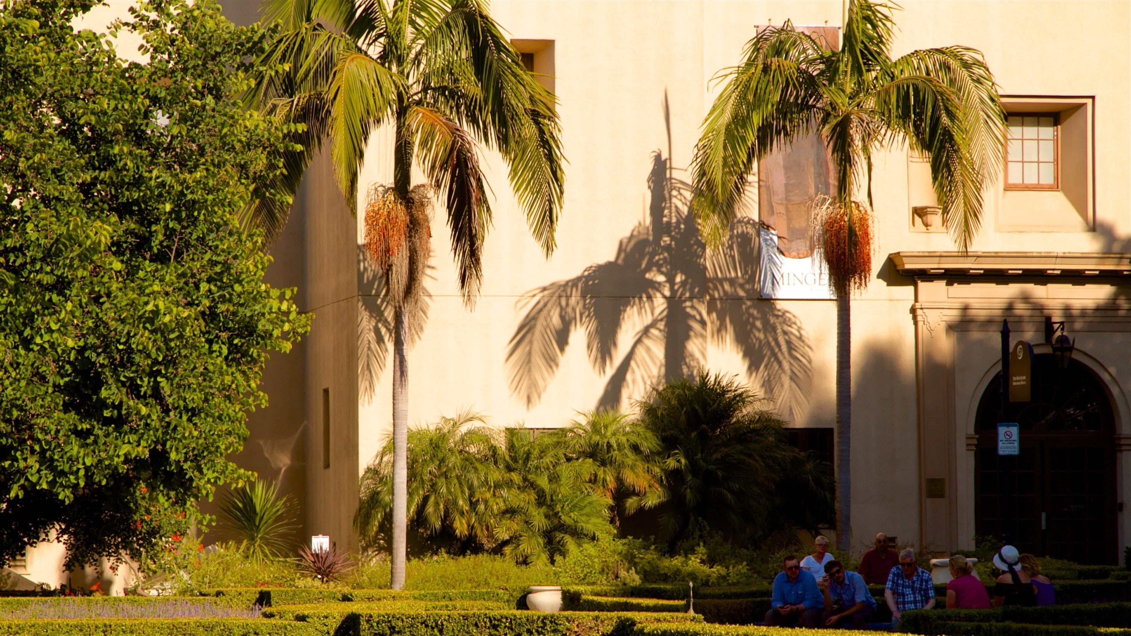 Alcazar Garden showing a park as well as a small group of people