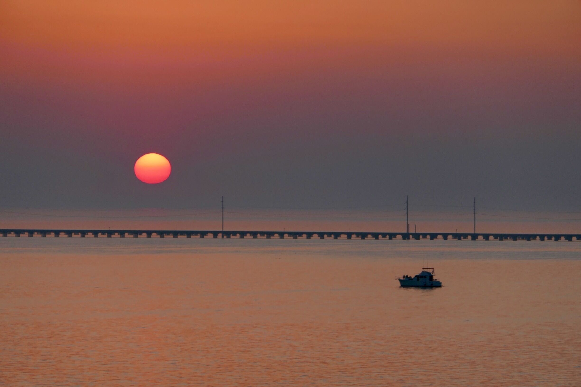 ... breathtaking sunset over the 24 miles long bridge (causeway) that was until recently in Guinness book as the longest bridge over water in the world