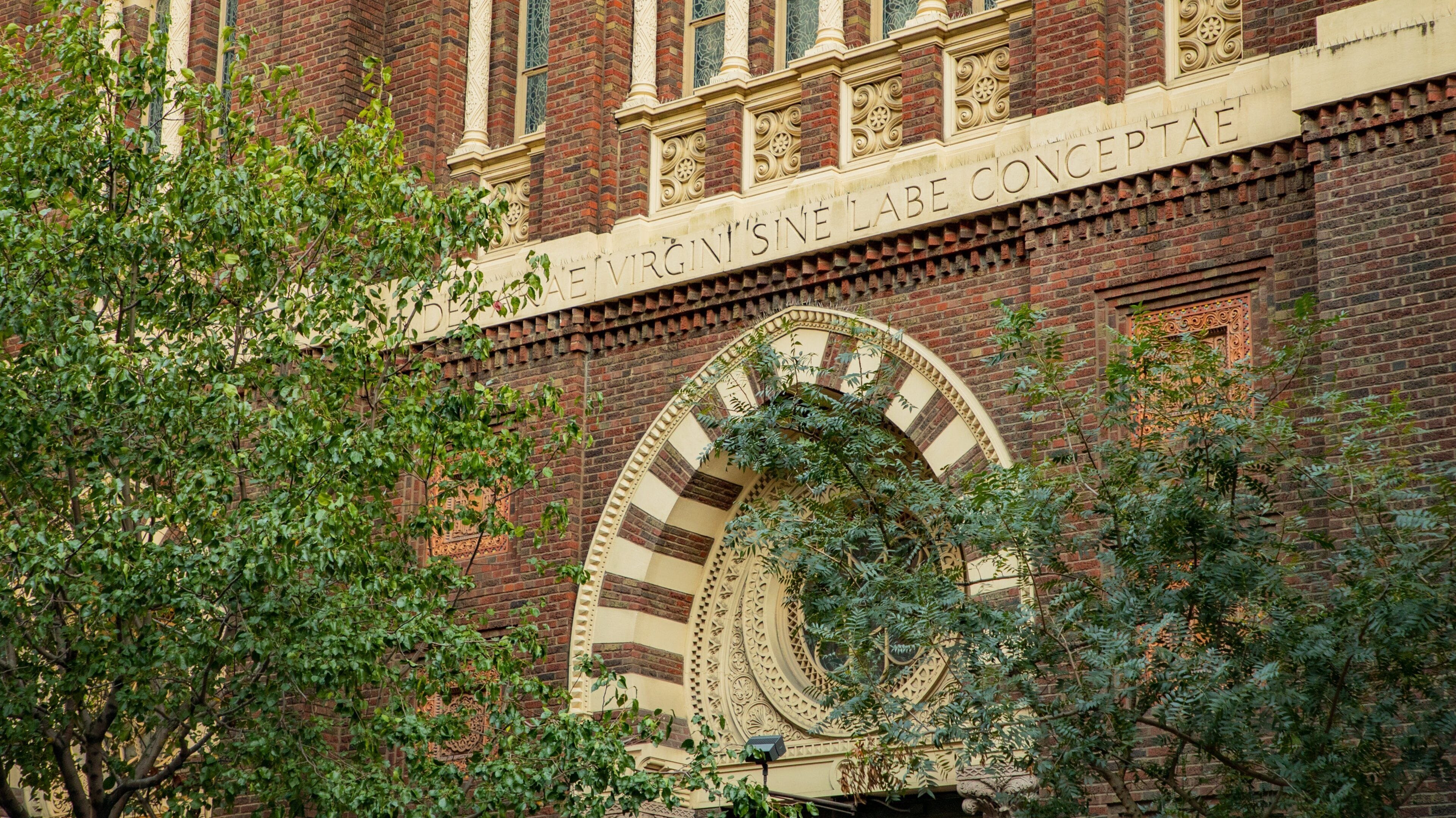 Immaculate Conception Church featuring heritage elements and signage