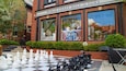 A chessboard with pieces outside a building labeled "World Chess Hall of Fame".