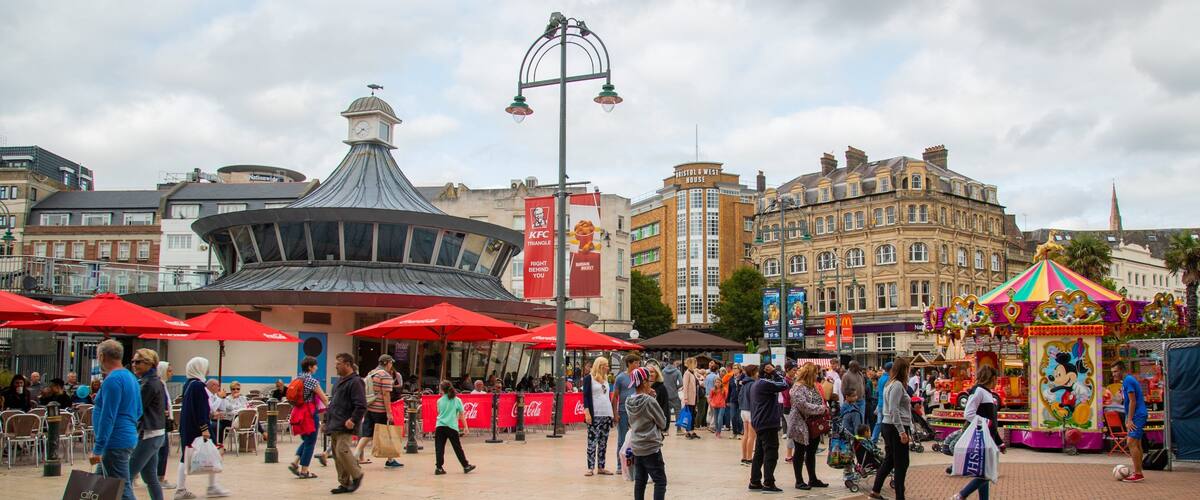 The Square which includes street scenes as well as a large group of people