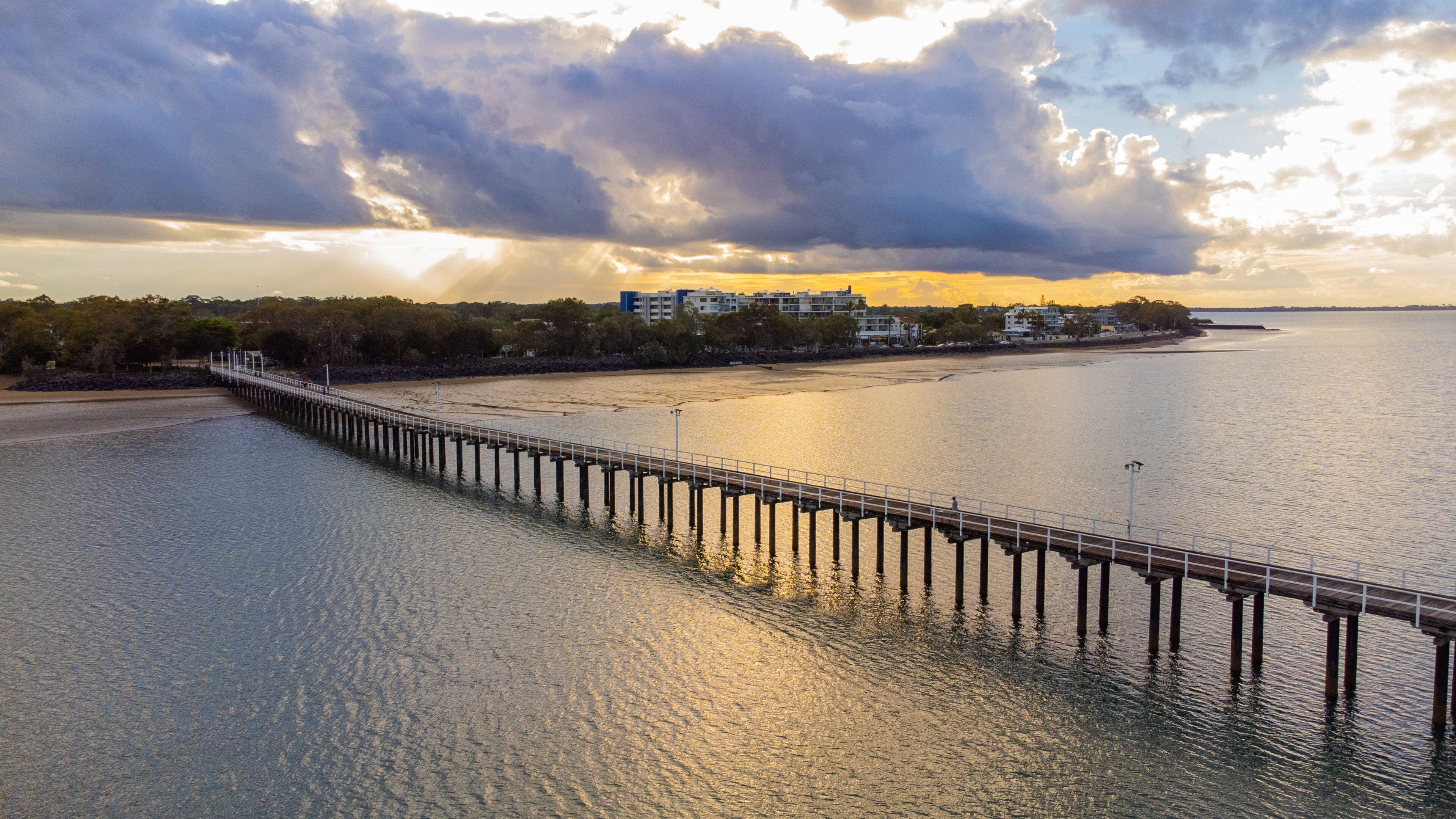 Urangan Pier which includes a bridge, landscape views and general coastal views
