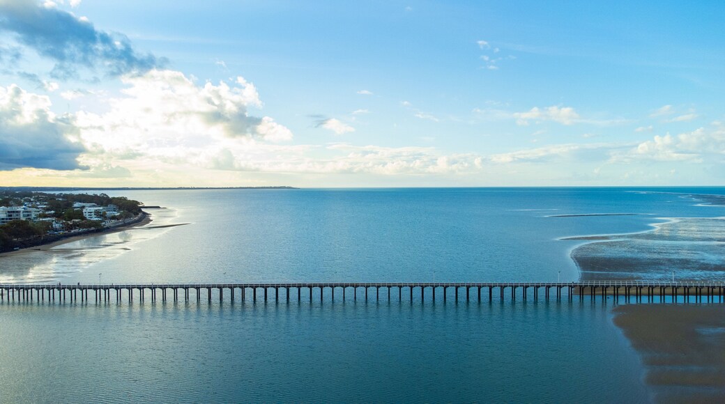 Urangan Pier featuring landscape views, a sunset and general coastal views
