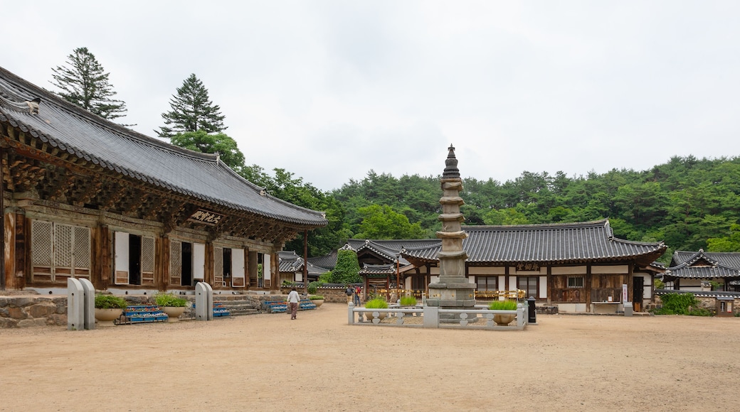 Pagoda (center) and Daegwangbojeon Hall (left) at historical Magoksa Temple or monastery in Gongju, South Korea. UNESCO World Heritage Site. Tourist attraction.