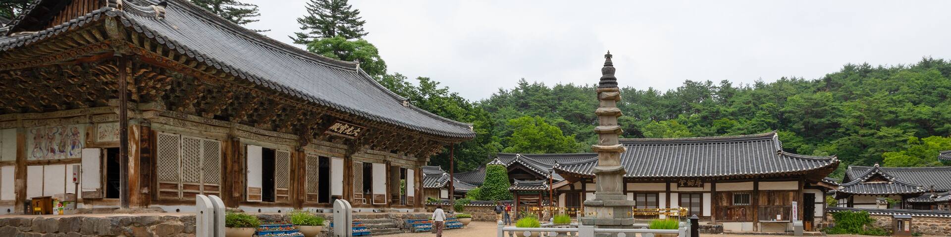 Pagoda (center) and Daegwangbojeon Hall (left) at historical Magoksa Temple or monastery in Gongju, South Korea. UNESCO World Heritage Site. Tourist attraction.