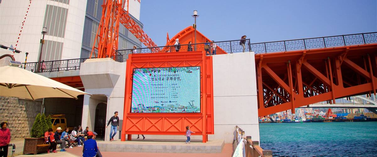 Yeongdodaegyo Bridge featuring a river or creek and a bridge as well as a small group of people