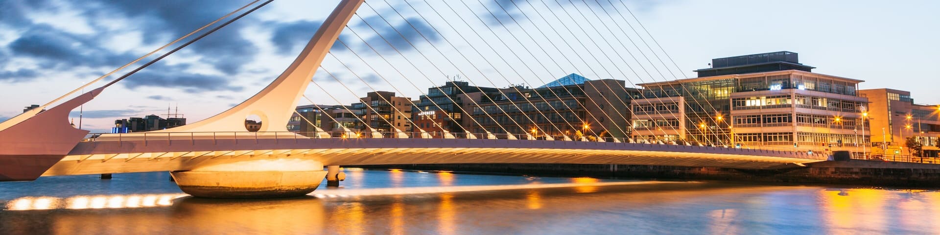 Samuel Beckett Bridge featuring a river or creek, a sunset and a bridge