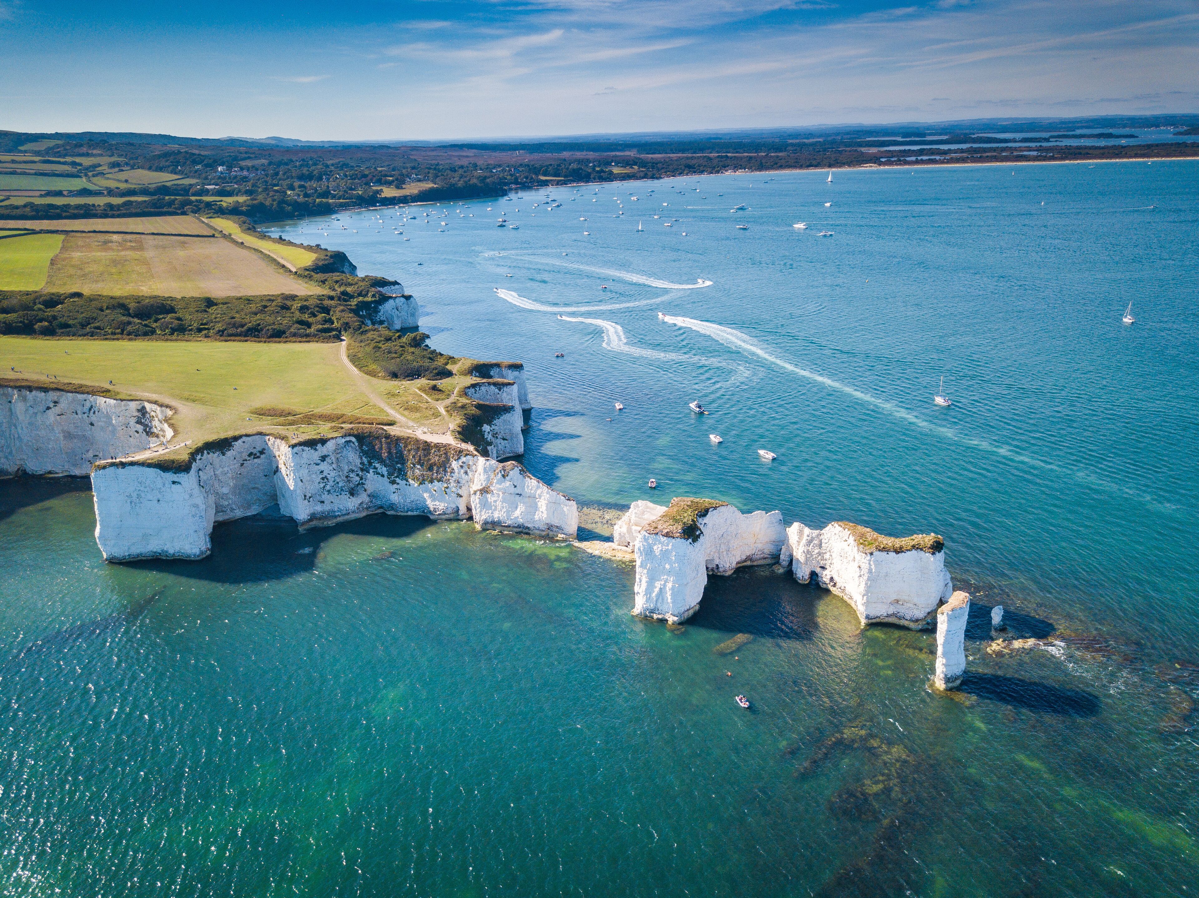 A coastal landscape with cliffs and a clear view of the sea.