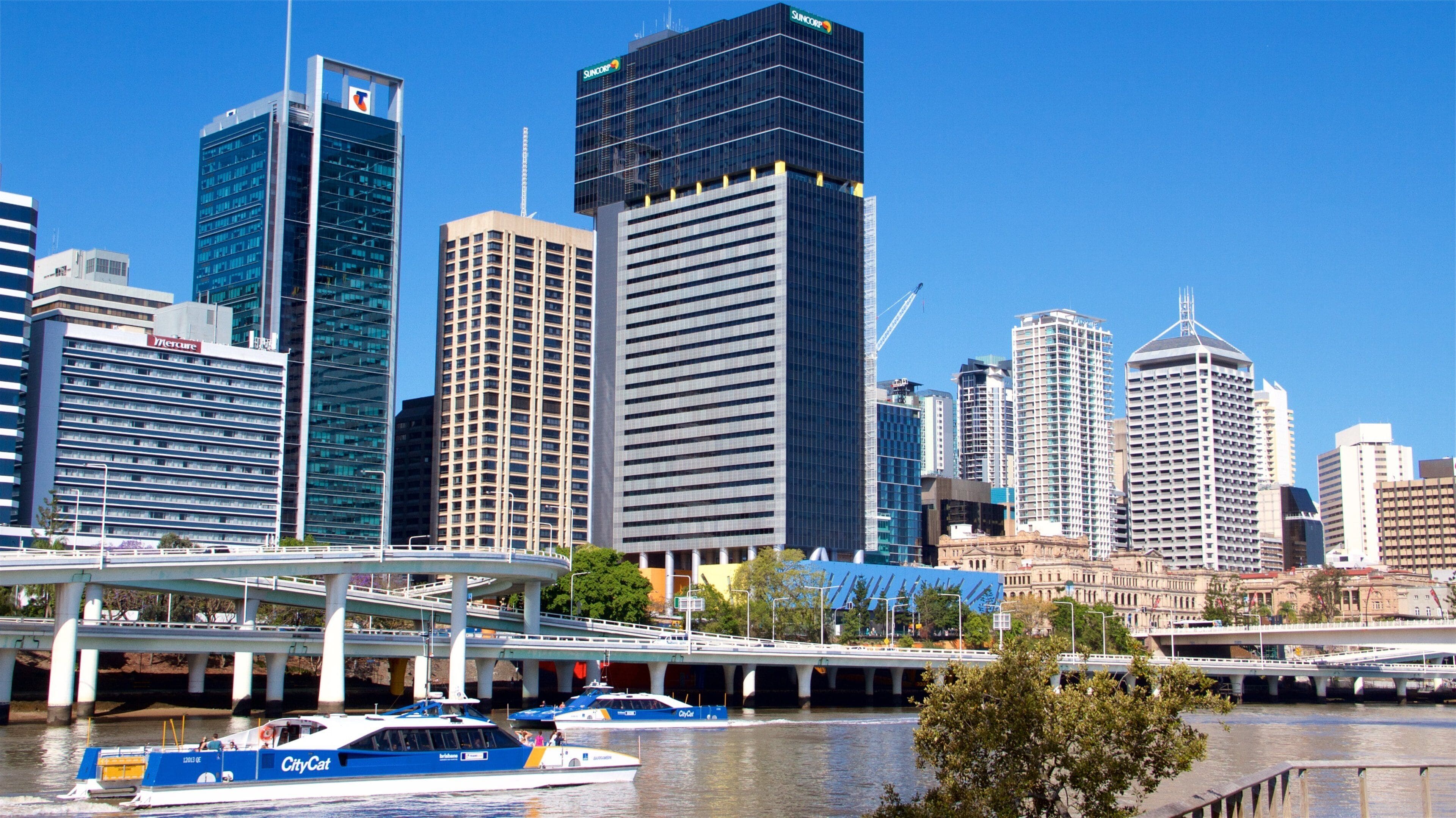 Southbank Parklands showing a city, a river or creek and a ferry