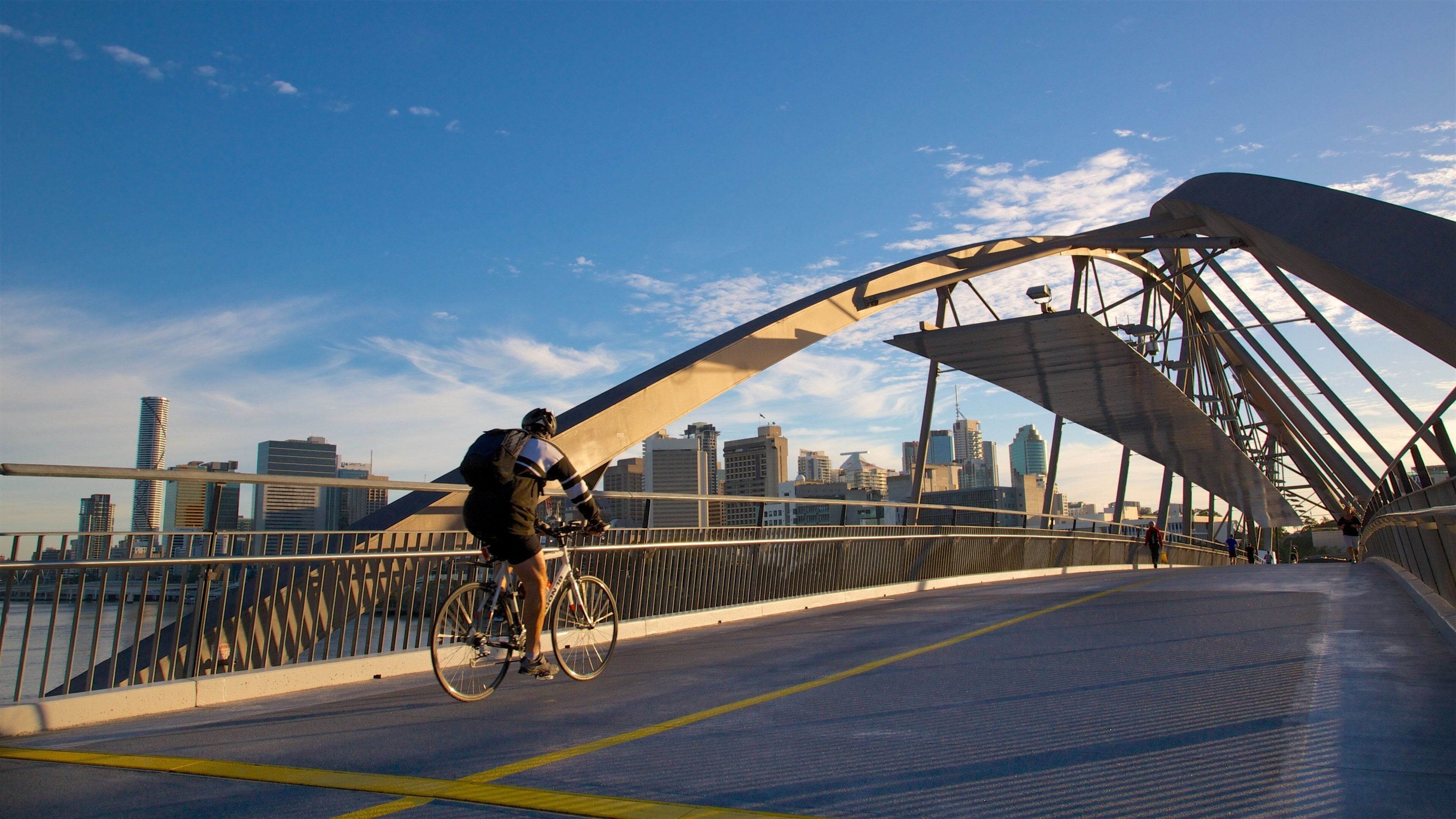 Southbank Parklands which includes a bridge, a city and a sunset