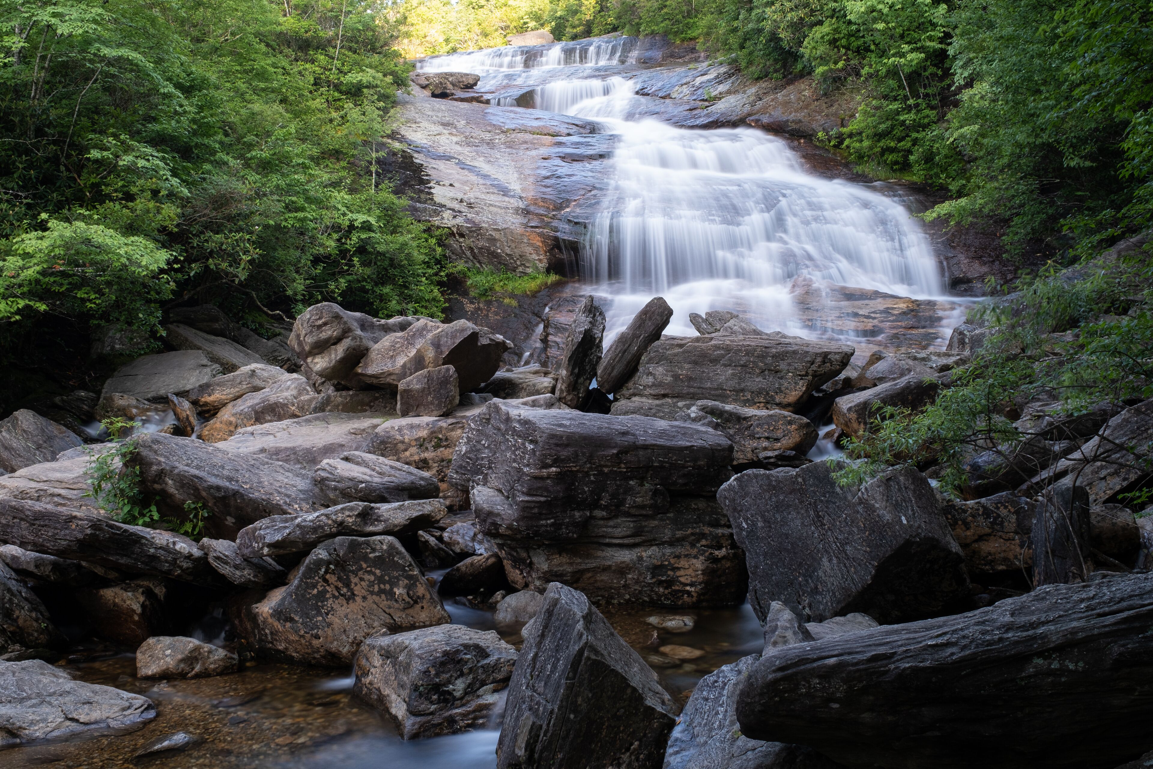The cascades of the Lower Falls in Graveyard Fields, a very popular waterfall and hiking destination near Asheville, North Carolina in the Blue Ridge Mountains off the Blue Ridge Parkway.