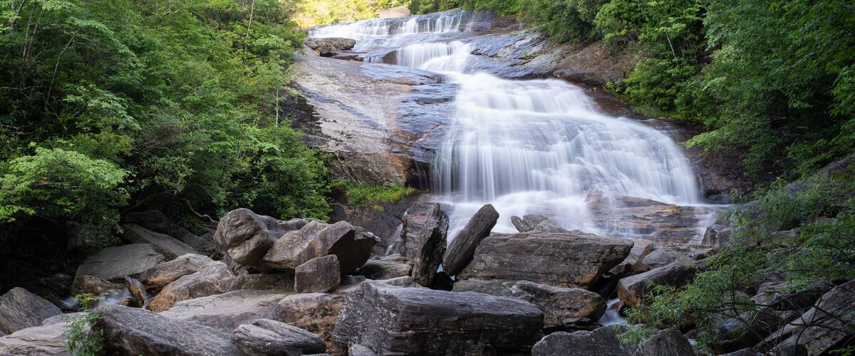 The cascades of the Lower Falls in Graveyard Fields, a very popular waterfall and hiking destination near Asheville, North Carolina in the Blue Ridge Mountains off the Blue Ridge Parkway.