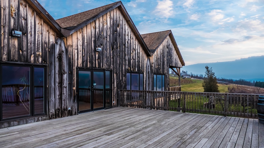 Wood deck and building in the Finger Lakes overlooking vineyards and Seneca Lake