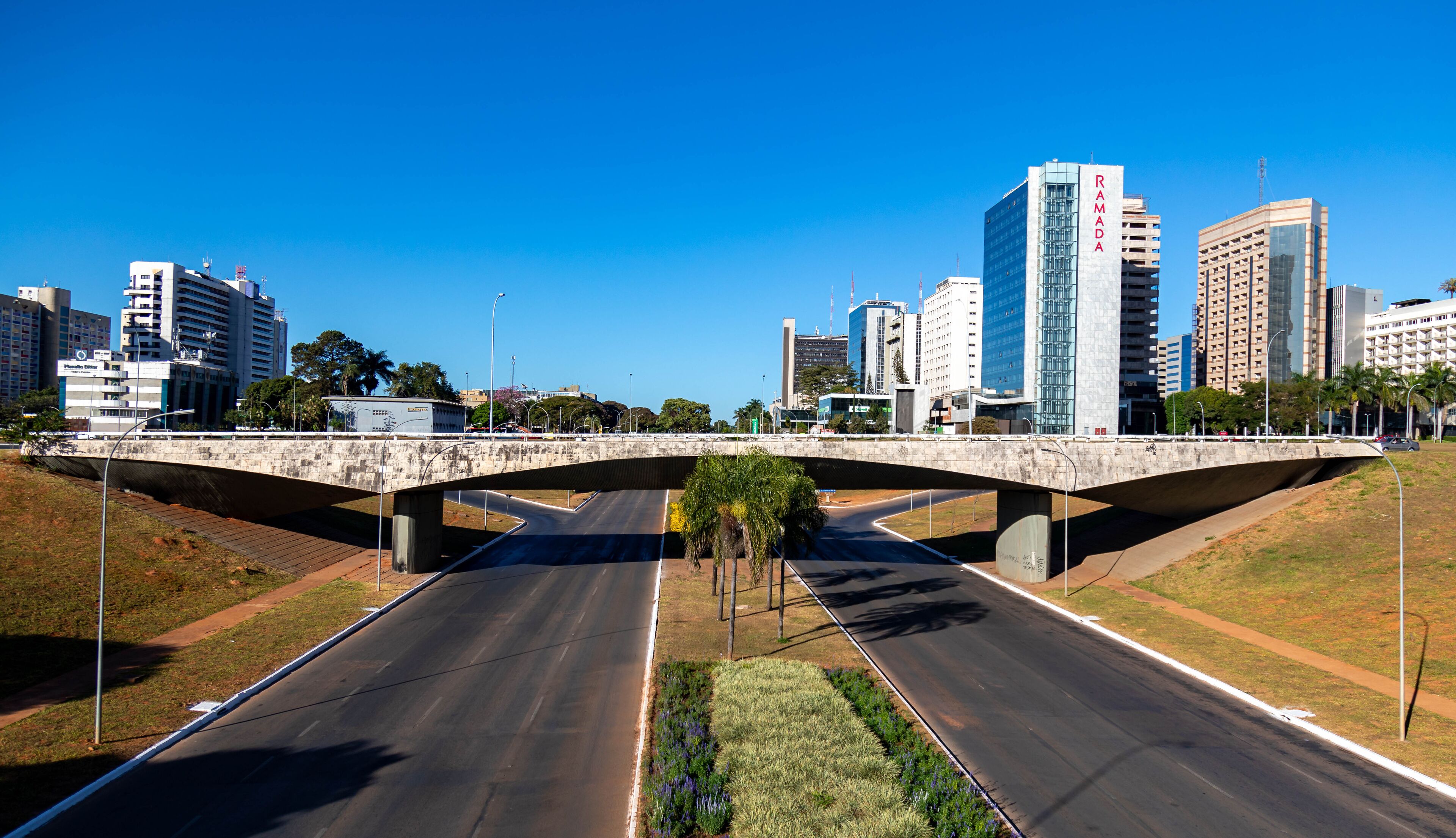 South hotel sector, Brasília shopping mall, Ramada hotel, Nacional hotel and others B Hotel and Brasil 21 shopping center with reflection in the lake in front of the TV tower