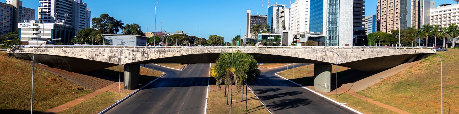 South hotel sector, Brasília shopping mall, Ramada hotel, Nacional hotel and others B Hotel and Brasil 21 shopping center with reflection in the lake in front of the TV tower